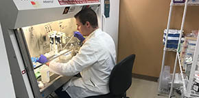 An employee performs testing for Gregor Diagnostics